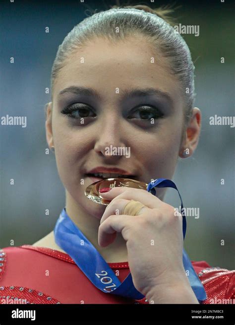 Winner Aliya Mustafina Of Russia Poses With Her Gold Medal After The