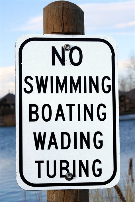 No Swimming Boating Wading Or Tubing Sign Picture Free Photograph