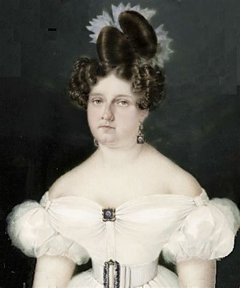 An Old Photo Of A Woman Wearing A White Dress With Large Hair In Her Bun