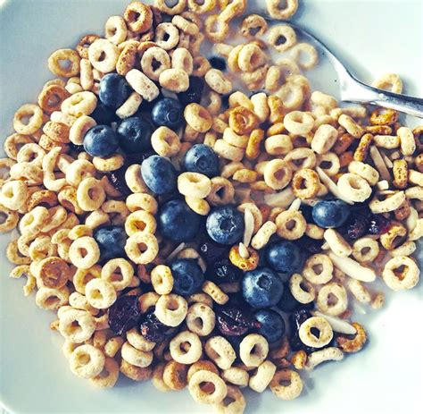 Multi Grain Cheerios With Slivered Almonds Craisins Fresh Blueberries And Almond Milk