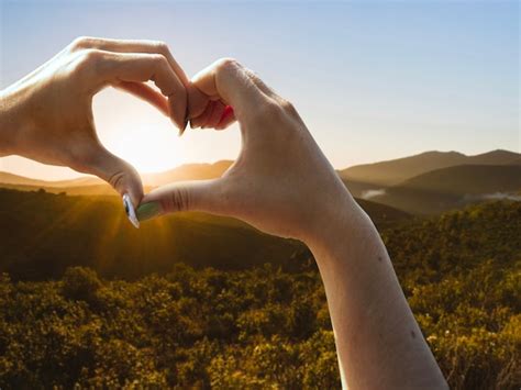 Free Photo | Heart-shaped hands on a sunset