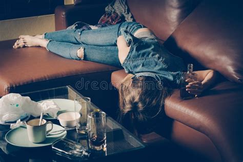 Young Drunk Woman On The Sofa Young Drunk Woman On The Sofa Alcoholism And Drug Addiction Lead