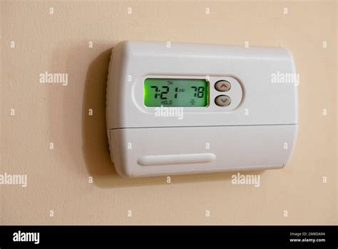 Programmable Digital Thermostat Set To Energy Saving 78 Degrees Wall