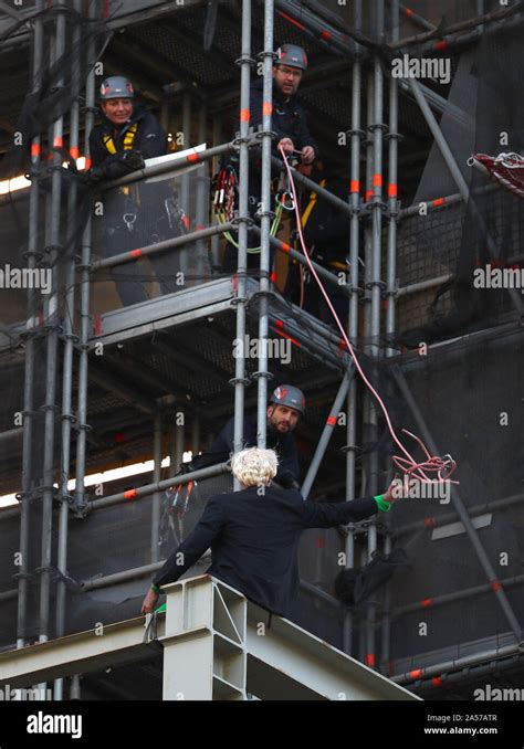 An Extinction Rebellion Protester Who Has Scaled The Scaffolding