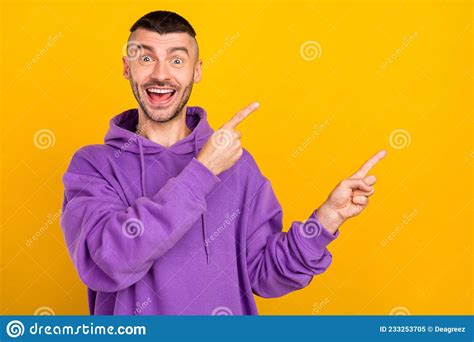 Photo Of Impressed Millennial Brunet Guy Point Empty Space Wear Purple