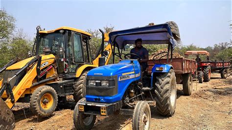 Jcb Dx Backhoe Loading Mud In Sonalika Di And Mahindra Di Tractor For