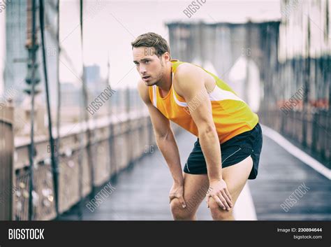 Tired Runner Taking Image And Photo Free Trial Bigstock