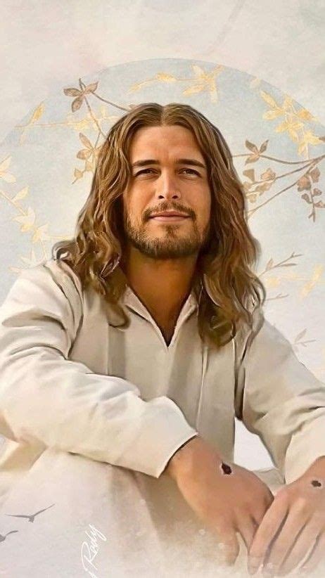 A Man With Long Hair And Beard Wearing A White Shirt Sitting In Front