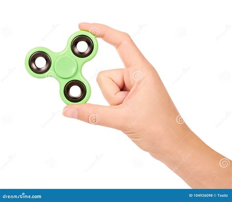 Green Fidget Spinner In Hand Isolated On White Background Stock Photo