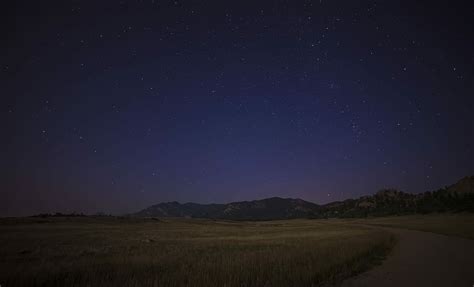 HD wallpaper: green grass field near mountain at night time photo ...