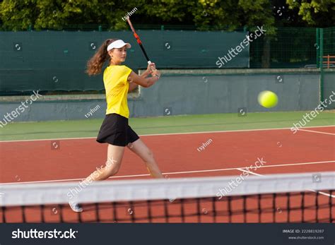 Professional Equipped Female Tennis Player Beating Stock Photo