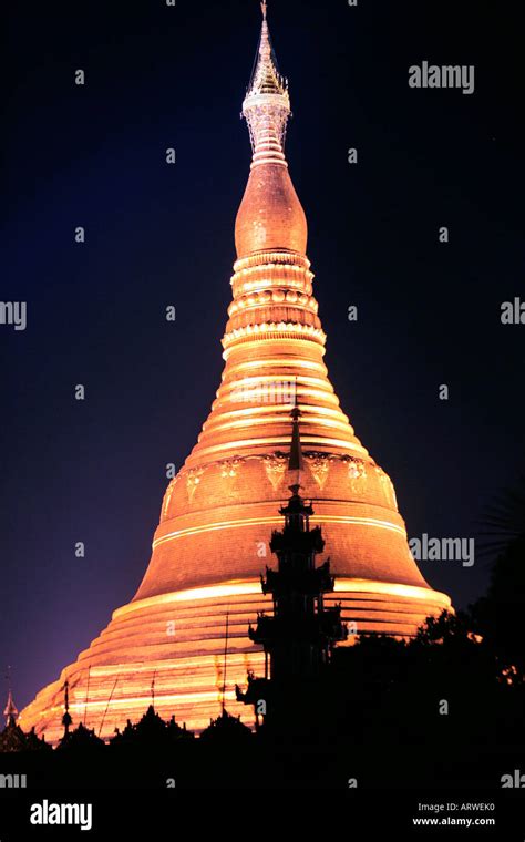 The Shwedagon Pagoda Illuminated Against The Night Sky Rangoon