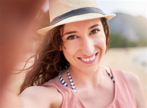 Premium Photo Sharing The Beach Vibes Portrait Of A Happy Young Woman