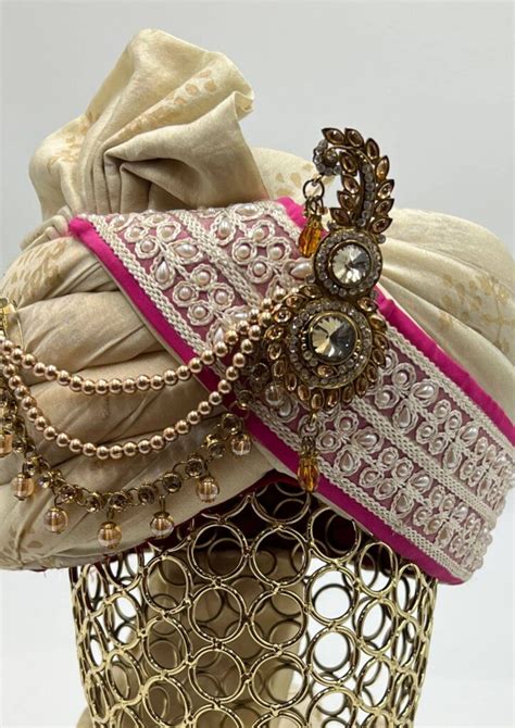 Beige Safa Turban With Pink Pearls Border And Gold Tone Kalgi Getethnic