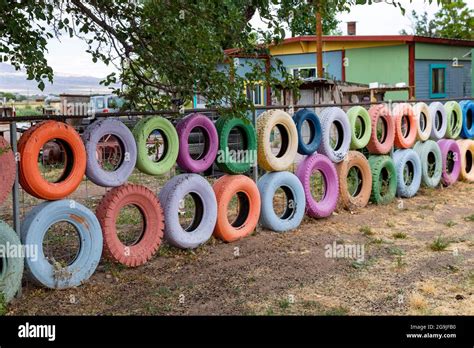 Escondida New Mexico Painted Tires Hung On A Homeowners Fence In