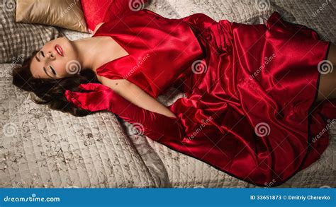 Sensual Brunette In A Red Dress Lying On The Bed Stock Image Image Of Portrait Gorgeous 33651873