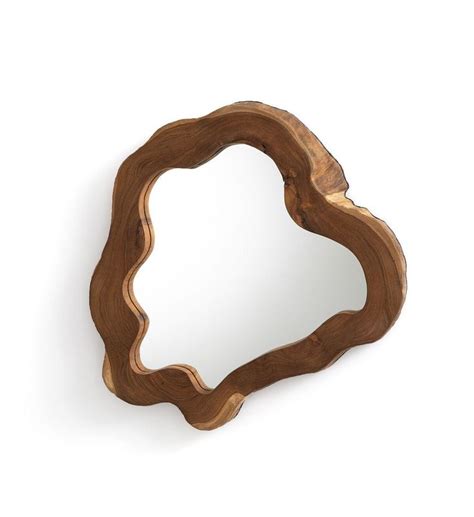 A Wooden Heart Shaped Mirror Sitting On Top Of A White Wall