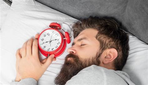 Premium Photo Portrait Of Man Sleeping With Alarm Clock In Bed Sleep Time