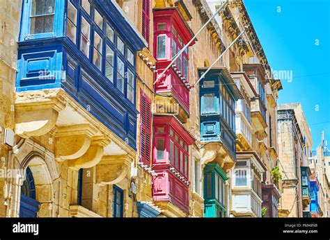 The Scenic Wooden Maltese Balconies Covered With Different Paints Are Traditional