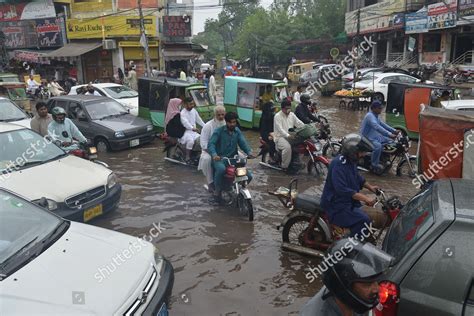 Pakistani People Wade Through Flooded Road Editorial Stock Photo