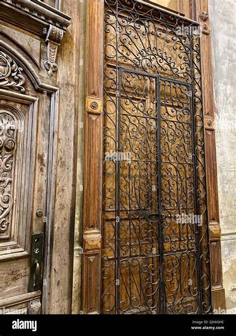 Closeup view of the hand carved wooden entrance door of La Mansión