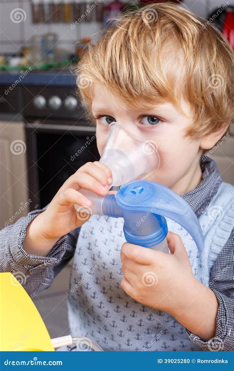 Adorable Toddler Boy Making Inhalation With Nebulizer Stock Photo