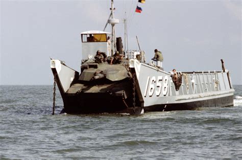 A Marine M1a1 Main Battle Tank Moves Down The Open Ramp Of Utility Landing Craft Lcu 1658 The