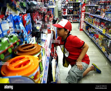 Boy looks at toys hi-res stock photography and images - Alamy