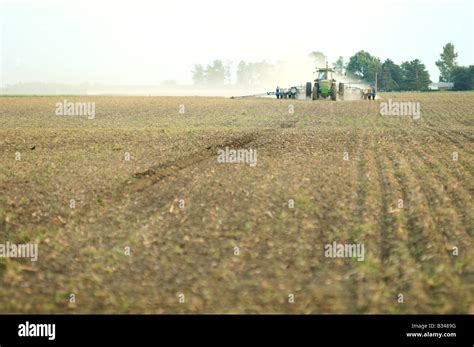 John Deere Tractor Planting Corn Or Soybeans In An American Farm Field