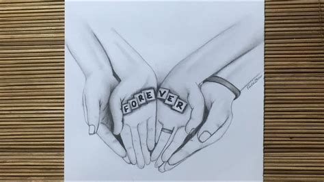 Two Hands Holding Each Other With The Word Forever Spelled On Them