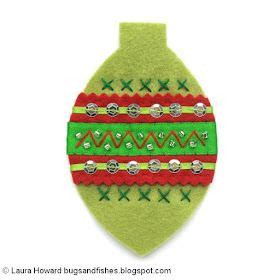 A Green Ornament With Red Yellow And Green Trimmings On It