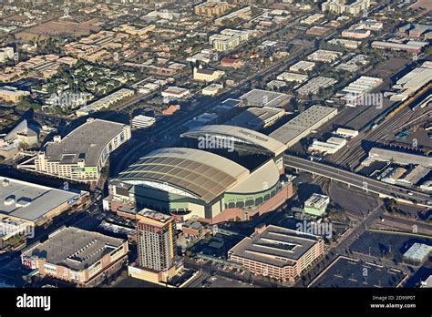 Aerial view from the airplane of retractable roof Chase Field baseball stadium and city skyline ...