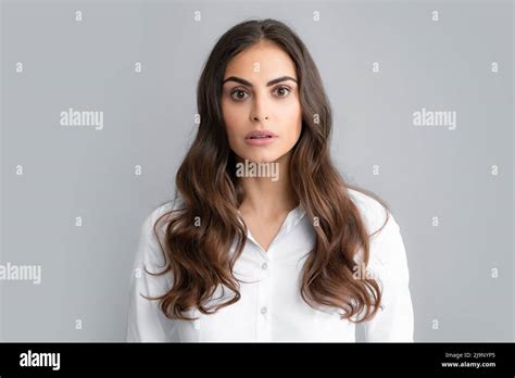 Surprised astonished young woman. Portrait of excited amazed gasping girl. Expressive facial ...