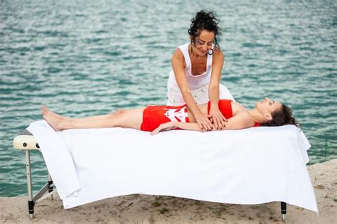 Premium Photo Smiling Massage Therapist Doing A Back Massage On Outdoor