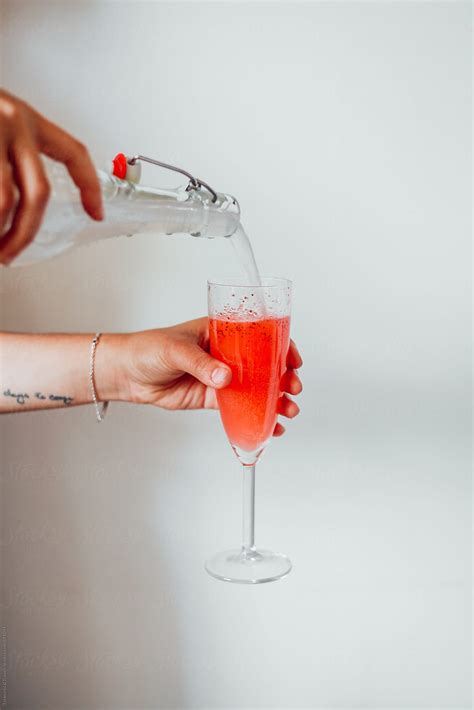 Pouring A Glass Of Champagne By Stocksy Contributor Pink House Organics Stocksy