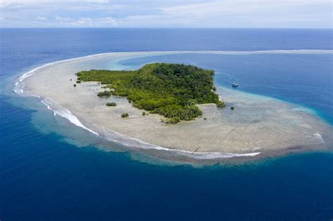 Aerial Of Gorgeous Island And Reef In Papua New Guinea Stock Photo