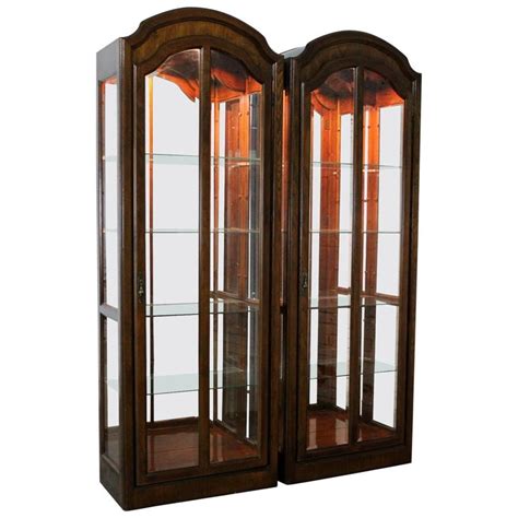 Lighted Curio Cabinets With Arched Top In Dark Wood A Vintage Pair At 1stdibs Arched Curio