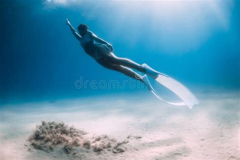 Freediver Posing With White Fins Attractive Woman Free Diver In Ocean