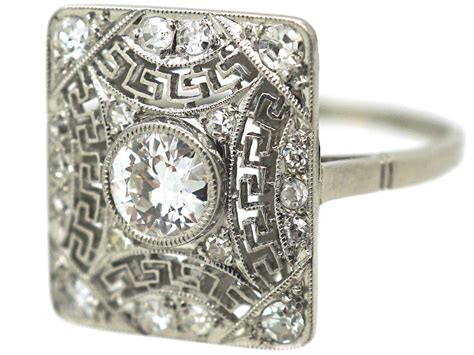 Art Deco Rectangular Platinum And Diamond Ring With Key Design Detail