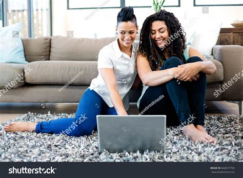 Smiling Lesbian Couple Sitting On Rug Stock Photo 606977705 Shutterstock