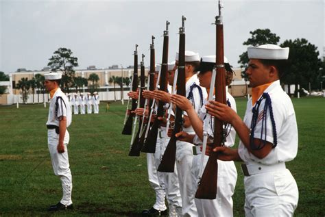 Recruits Display Their M1903 Rifles In Present Arms Position During