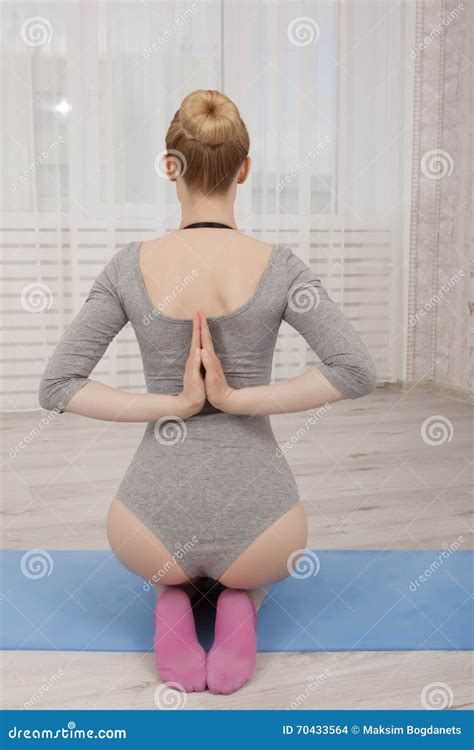 Beautiful Blonde Woman Practicing Yoga Stretching At Home On Blue Mat