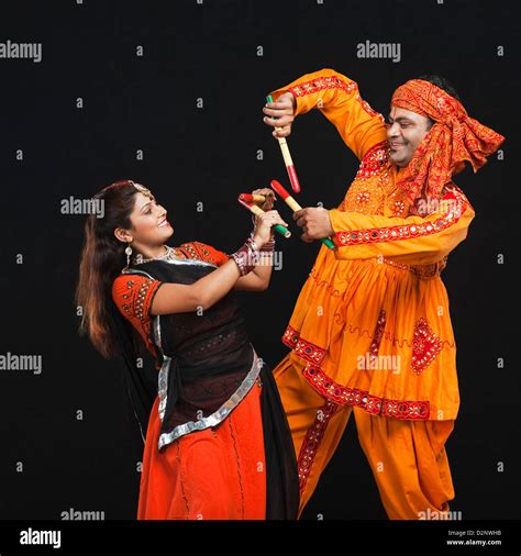 Couple Performing Dandiya Stock Photo Alamy