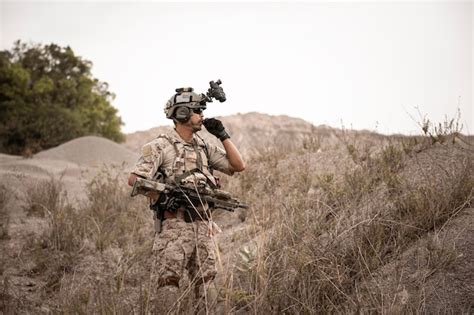 Premium Photo Soldiers In Camouflage Uniforms Aiming With Their