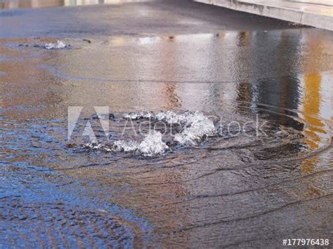 Rain Water Flows Up Out Of Clogged Drain Cover Causing Flood In Selce