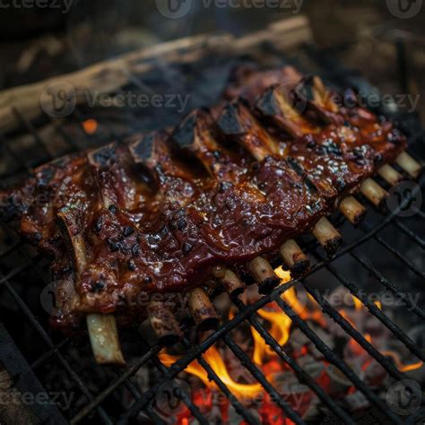 Sizzling Spit Roasted Cow Ribs Irresistible Bbq Delight Stock