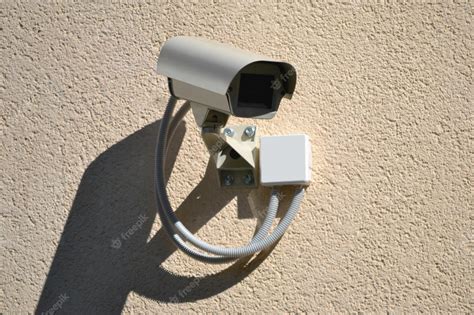 Premium Photo | Security camera installed on a wall