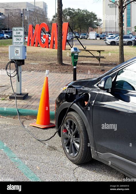 Chevy Bolt EUV Electric Car Or Automobile Plugged Into A Street