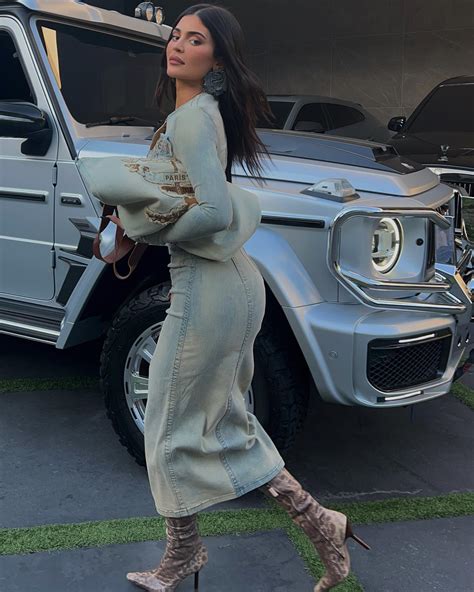 Kylie Jenner Spills Out Of Ripped Denim Dress As She Poses In K