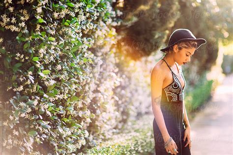 Beautiful Back Lit Portrait Of A Young Stylish Hispanic Woman By Stocksy Contributor Kristen